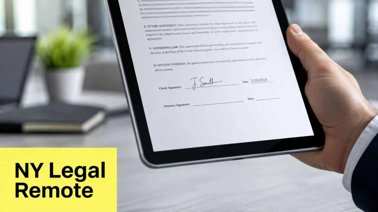 A person holding a tablet displaying a legal document with a signature and New York governing law.